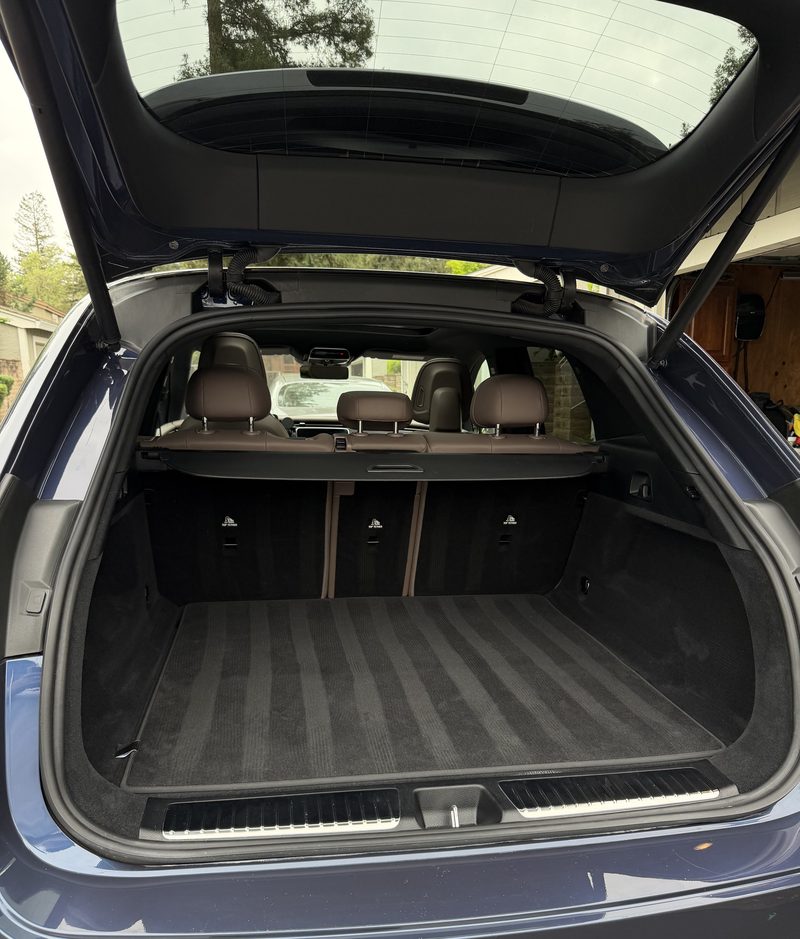 Open tailgate of an estate car with the cargo area cleaned
