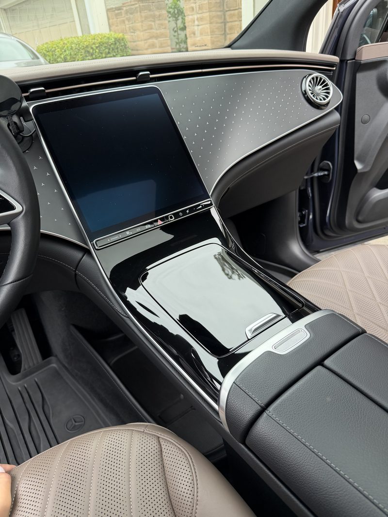 Detailed dashboard and centre console of a luxury electric saloon